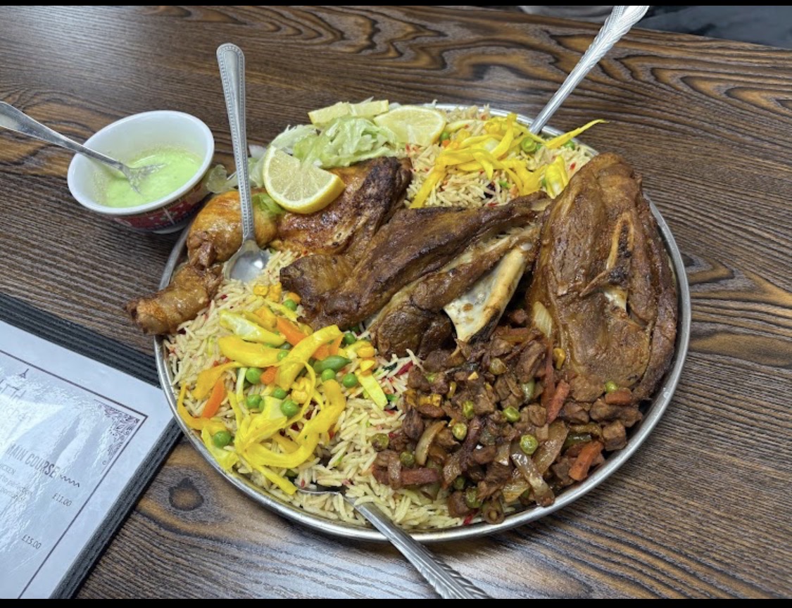 East African platter with lamb, rice, chicken and salad